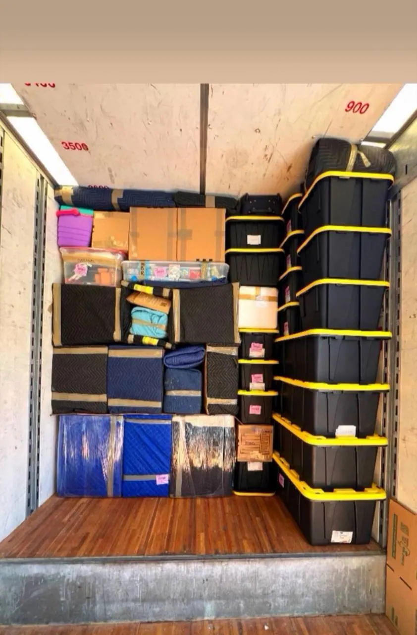 Truck interior loaded in tiers with straps