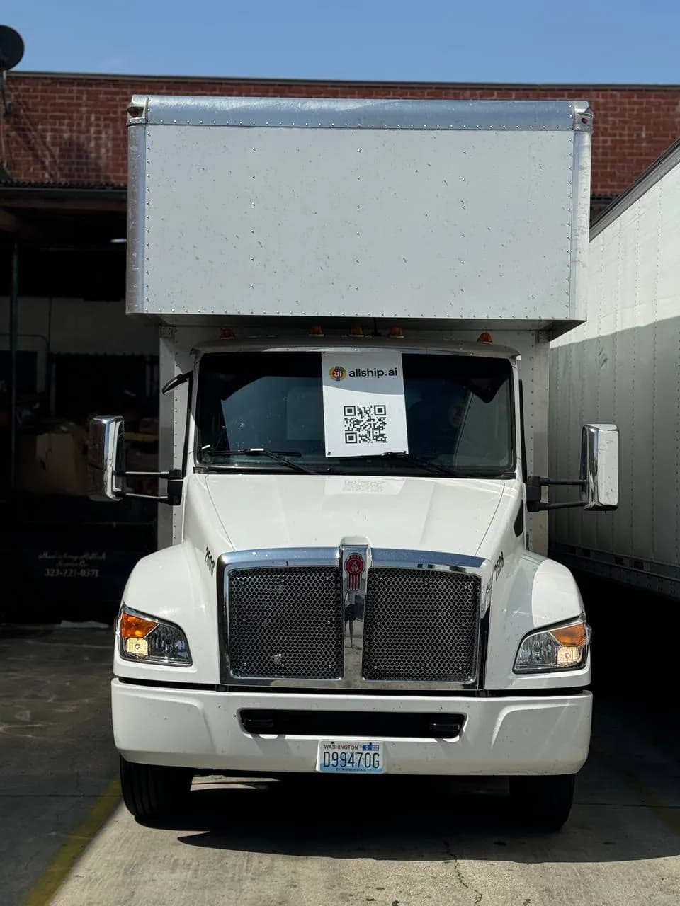 White box truck at a loading dock