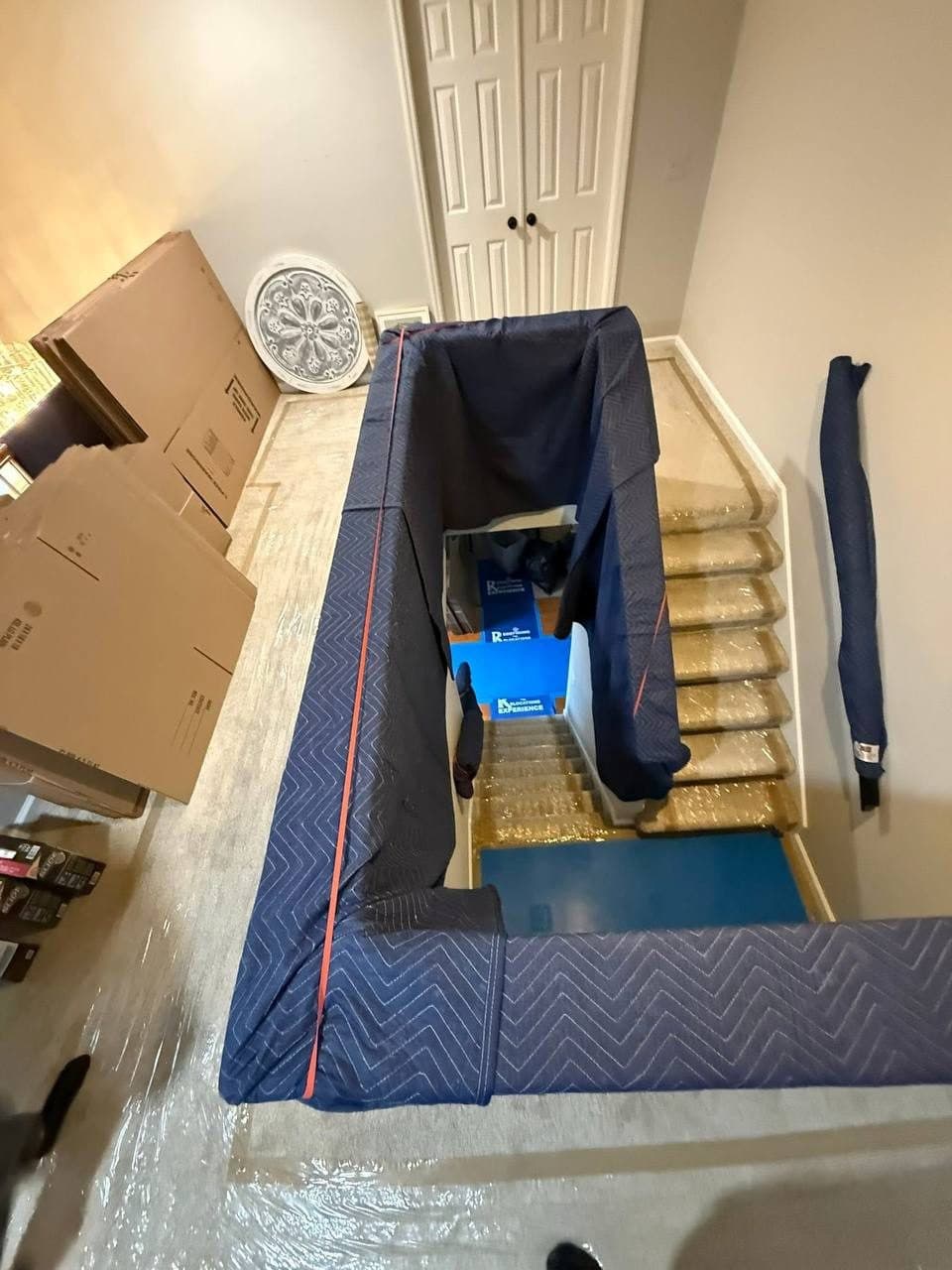 Stairway padded to protect it while moving heavy items